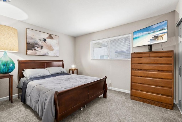 bedroom featuring light carpet