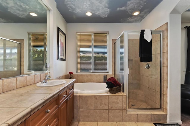 bathroom featuring vanity, tile patterned floors, and independent shower and bath