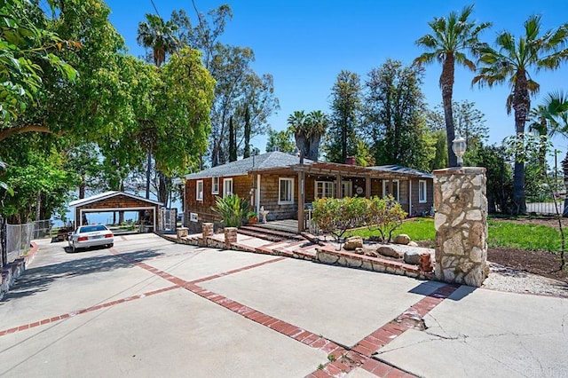 single story home with an outbuilding and a garage