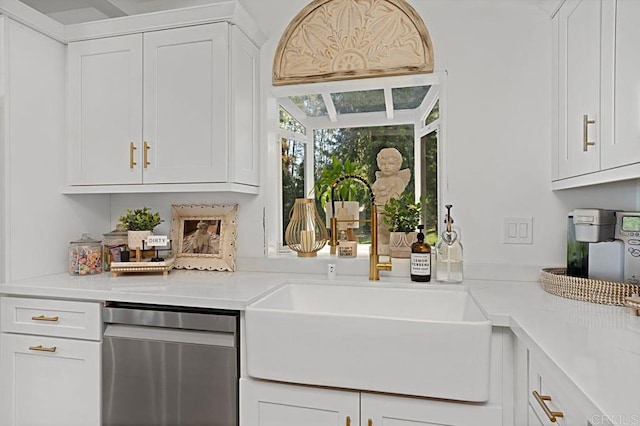 bar with stainless steel dishwasher, white cabinetry, and sink