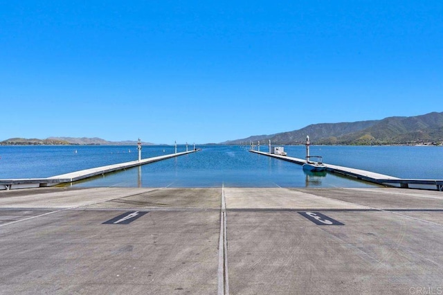 dock area with a water and mountain view