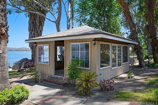 view of front of home with a water view