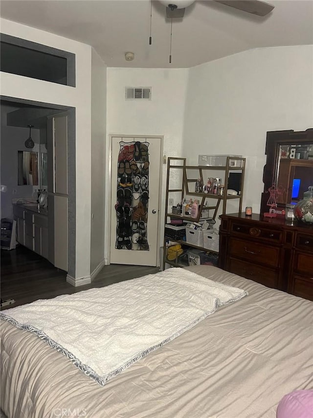 bedroom featuring ceiling fan and dark hardwood / wood-style flooring