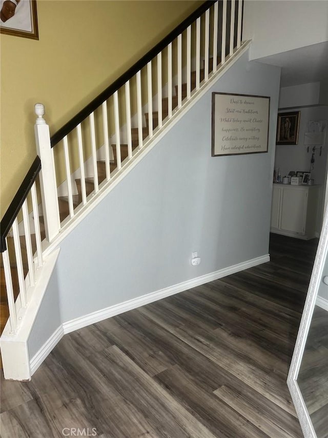 stairs featuring wood-type flooring