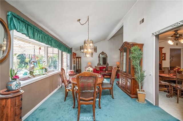 dining room with ceiling fan with notable chandelier, carpet floors, and vaulted ceiling