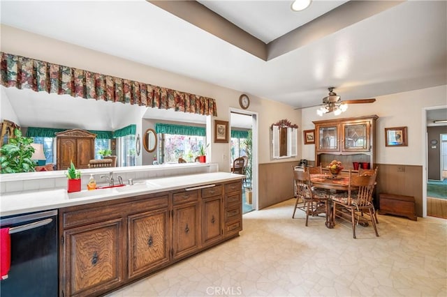 kitchen featuring stainless steel dishwasher, ceiling fan, and sink