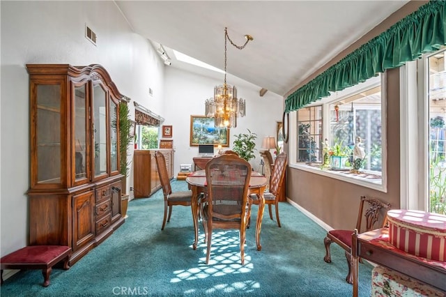 dining room with carpet flooring, lofted ceiling, and a notable chandelier