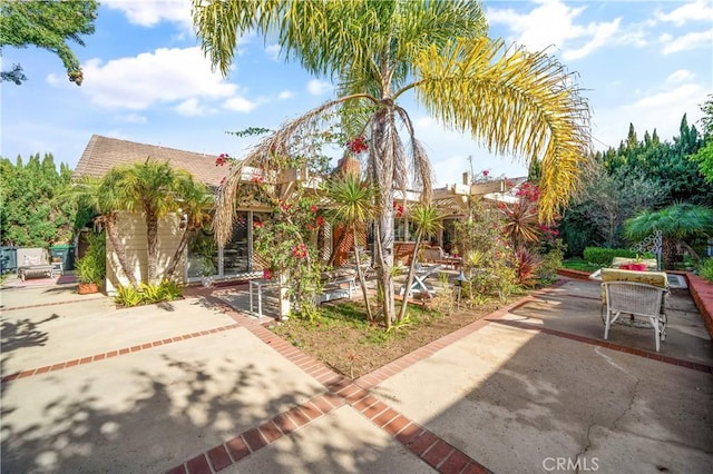 view of property's community with a patio