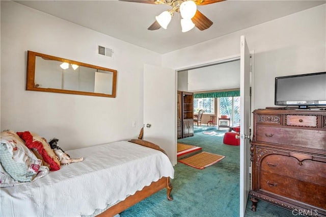 bedroom with ceiling fan and carpet