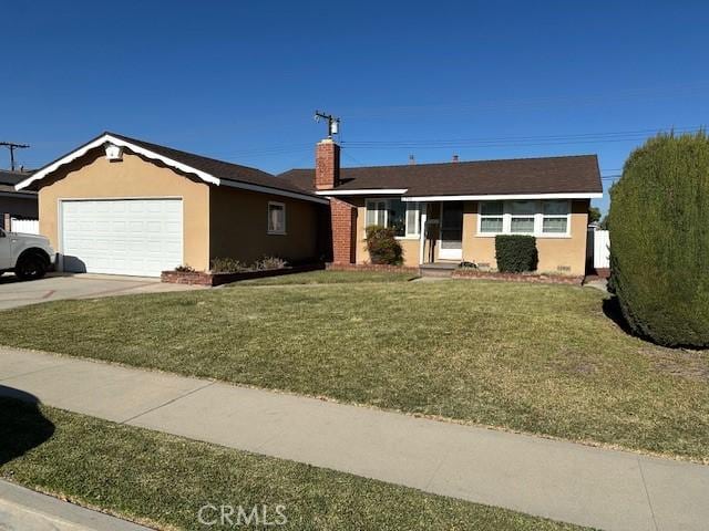 ranch-style house featuring a front lawn and a garage