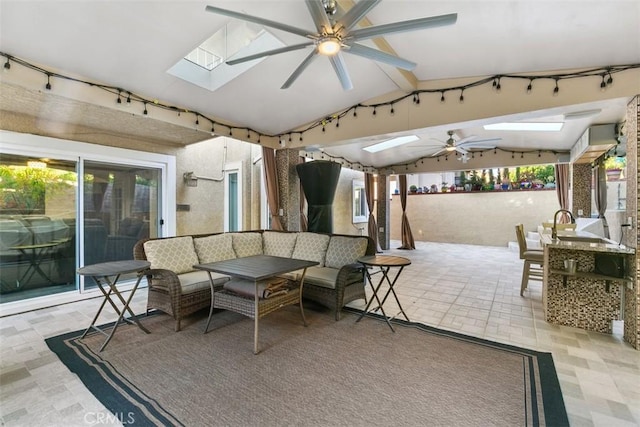 view of patio with an outdoor living space and ceiling fan