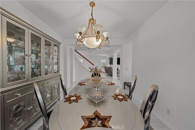 dining space featuring a chandelier