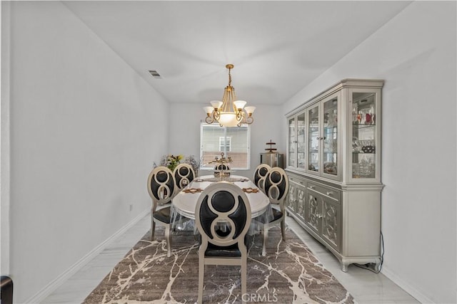 dining room with a notable chandelier