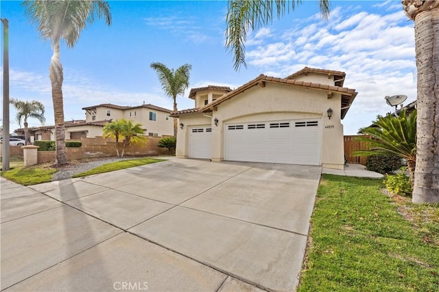 mediterranean / spanish-style house featuring a garage