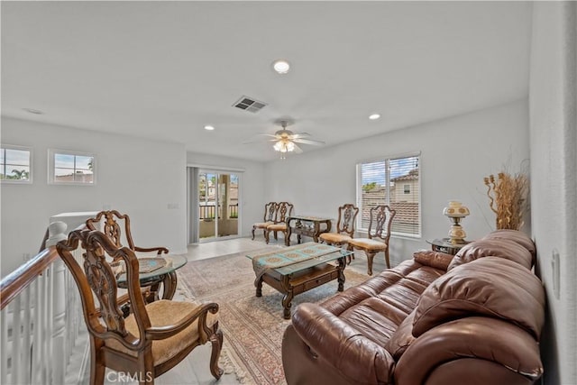 tiled living room featuring ceiling fan