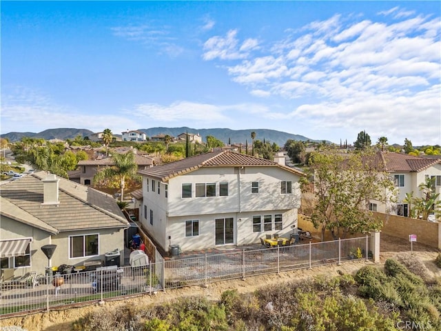 rear view of property with a mountain view