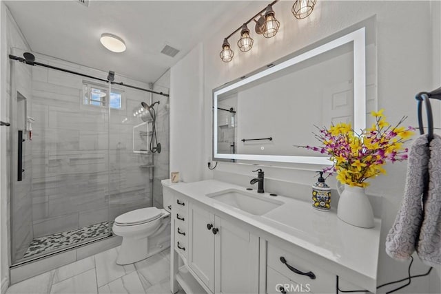 bathroom featuring toilet, an enclosed shower, and vanity