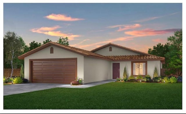 view of front facade with a garage and a yard