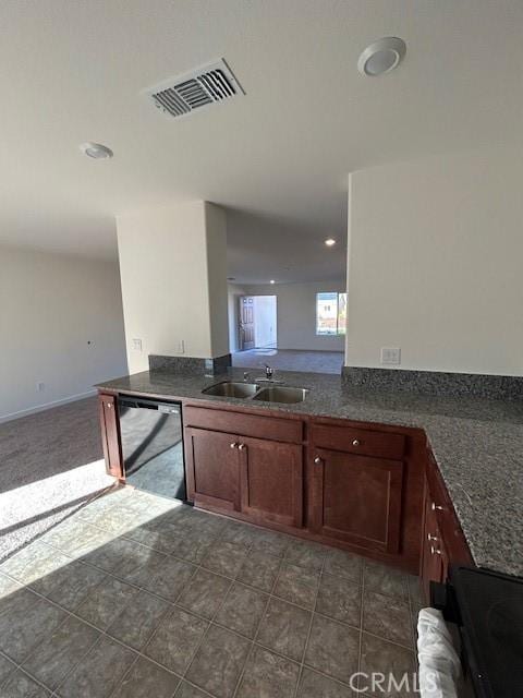 kitchen featuring kitchen peninsula, dishwasher, dark tile patterned floors, and sink