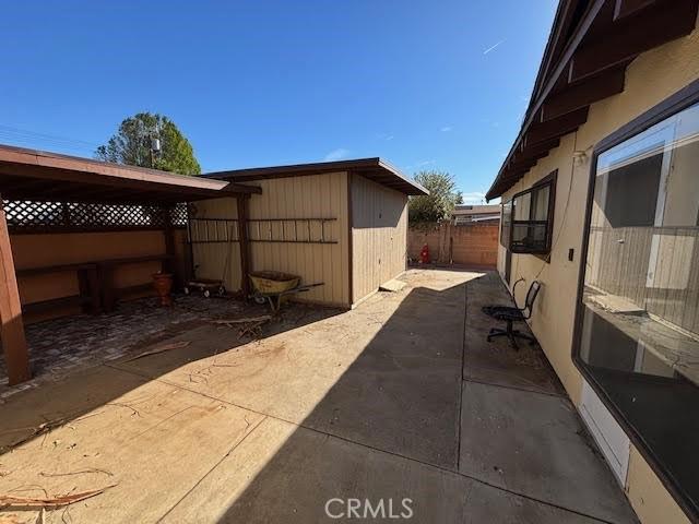 view of property exterior with a patio