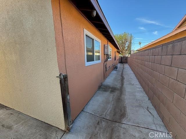 view of side of property with a patio area