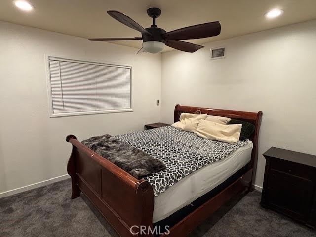 carpeted bedroom with ceiling fan