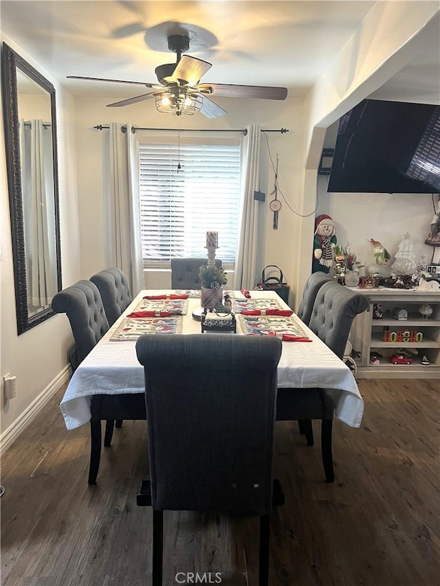 dining room with dark hardwood / wood-style flooring and ceiling fan