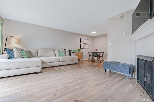 living room with light hardwood / wood-style floors