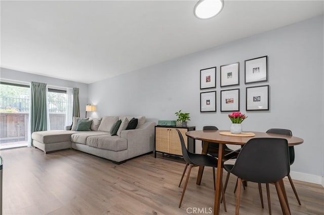 living room with light hardwood / wood-style flooring