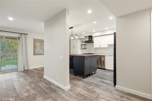 kitchen with dishwasher, hanging light fixtures, ventilation hood, white cabinets, and light wood-type flooring