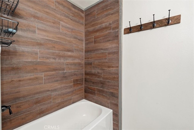 bathroom featuring wooden walls