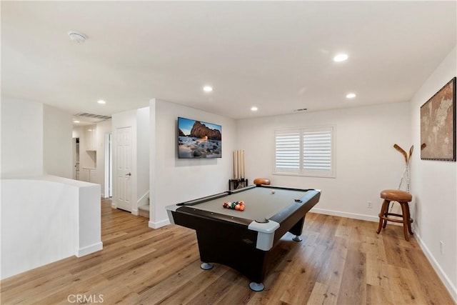 game room with light wood-type flooring and pool table