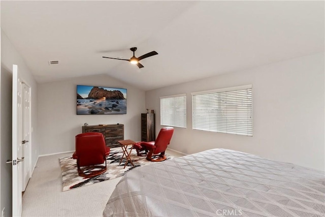 carpeted bedroom with ceiling fan and lofted ceiling