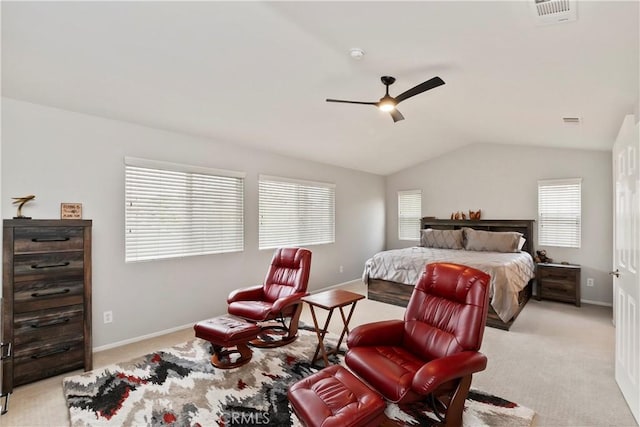 carpeted bedroom with multiple windows, ceiling fan, and lofted ceiling