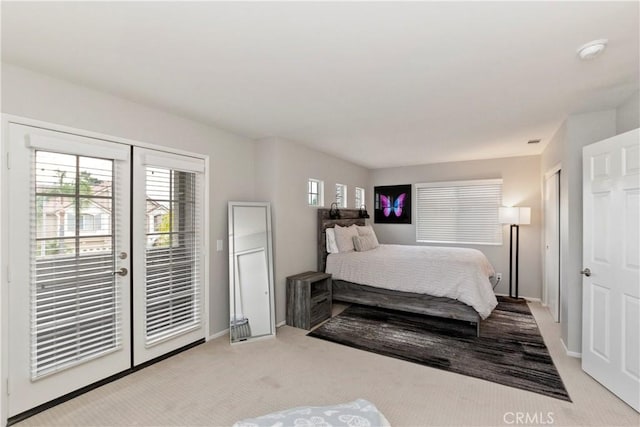 carpeted bedroom featuring access to exterior