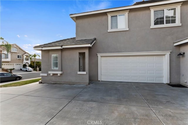 front of property with a garage