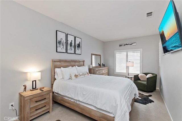 bedroom featuring light colored carpet