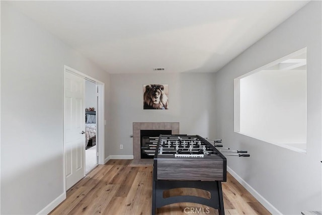 playroom with light hardwood / wood-style flooring