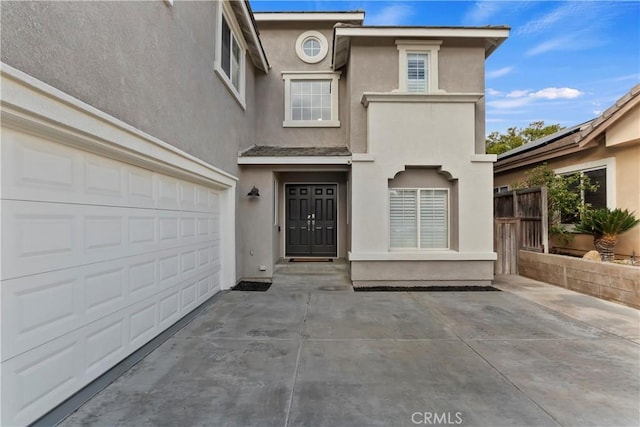 entrance to property featuring a garage