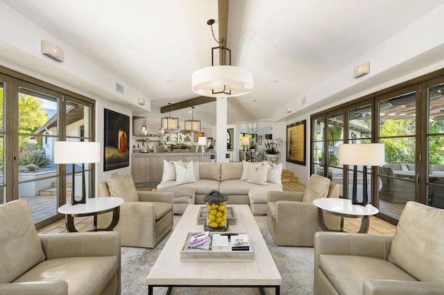 living room with lofted ceiling with beams