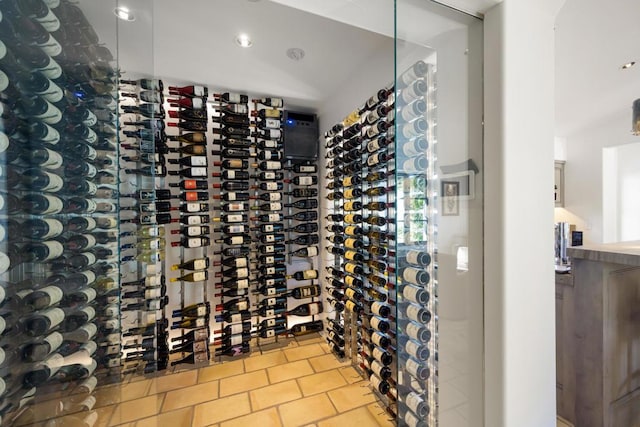 wine room featuring tile patterned flooring and electric panel