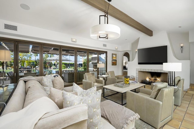 tiled living room featuring vaulted ceiling with beams