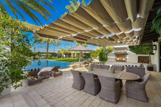 view of patio / terrace with exterior fireplace