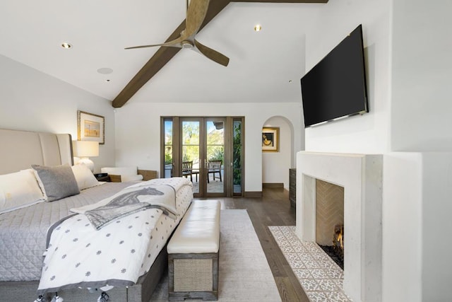 bedroom featuring french doors, lofted ceiling with beams, hardwood / wood-style flooring, ceiling fan, and access to exterior