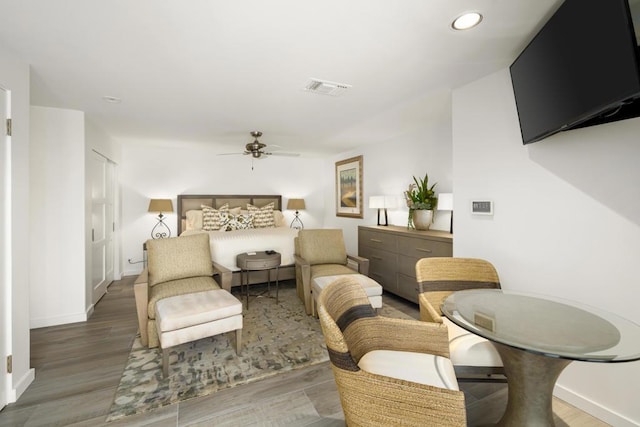 bedroom with ceiling fan and wood-type flooring