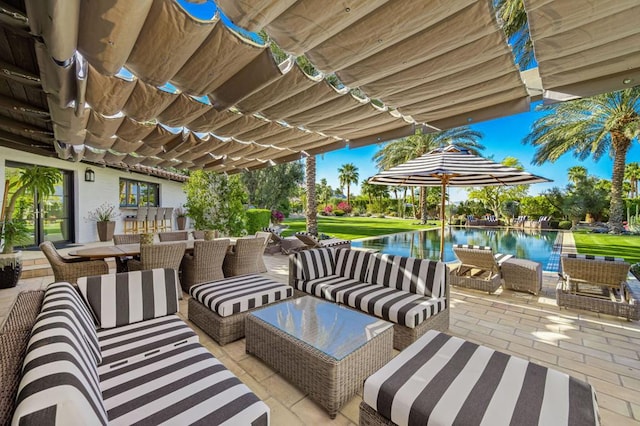 view of patio with outdoor lounge area and a water view