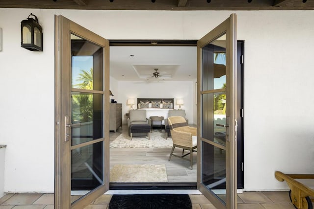 entryway with ceiling fan and light hardwood / wood-style flooring