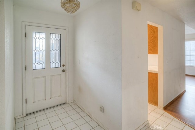 entryway featuring light tile patterned flooring