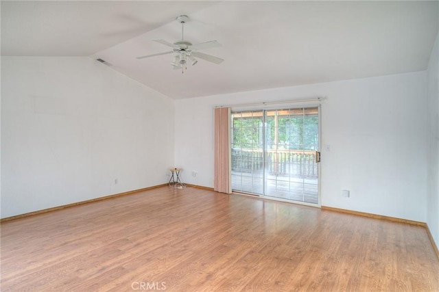 spare room with light hardwood / wood-style floors, vaulted ceiling, and ceiling fan