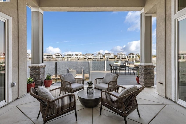 view of patio / terrace featuring an outdoor living space and a water view